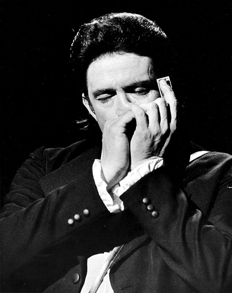 Johnny Cash playing a harmonica Photo Print (8 x 10)