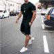 thumbnail image 4 of Conjuntos básicos de camiseta y pantalones cortos, trajes deportivos sencillos informales, chándal elegante Kpop para gimnasio elástico 5xl, ropa de lujo para hombres, parte superior holgada para homb, 4 of 5