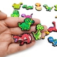 thumbnail image 3 of Serie de dinosaurios: 20 piezas de accesorios para zapatos de fútbol, ​​accesorios para zapatos de dibujos animados, utilizados para zapatos perforados, pulseras, fiestas, decoración de bricolaje., 3 of 5