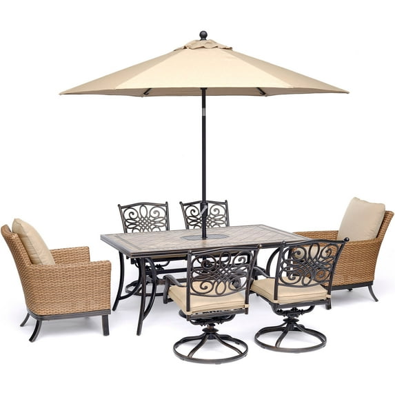 Hanover Monaco 7-Piece Patio Dining Set with 4 Swivel Rockers, 2 Woven Arm Chairs, a 40" x 68" Tile-Top Table, and a 9-Ft. Umbrella