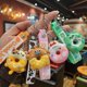 thumbnail image 2 of Llavero creativo con forma de donut de PVC de goma suave con forma de dinosaurio para coche, colgante de bolso para niños kawaii, accesorios de cumpleaños, 2 of 5