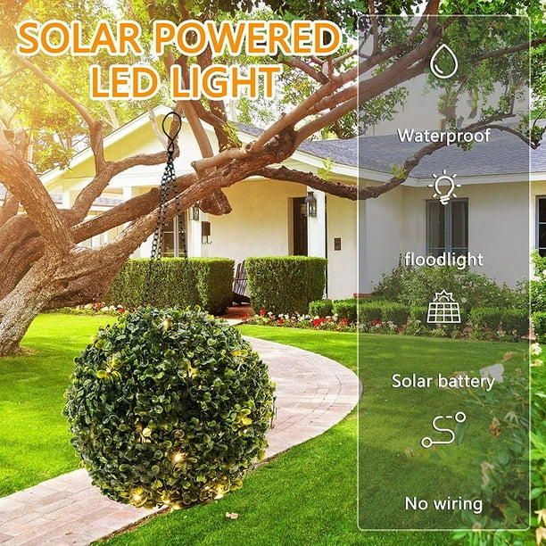 Artificial topiary trees top with solar lights