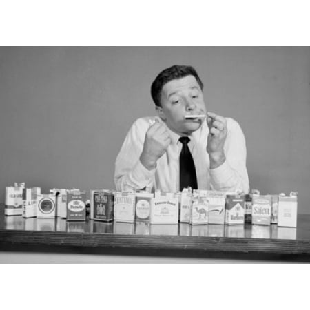 Mid adult man smelling a cigarette Poster Print (Best Selling Cigarettes In The World)