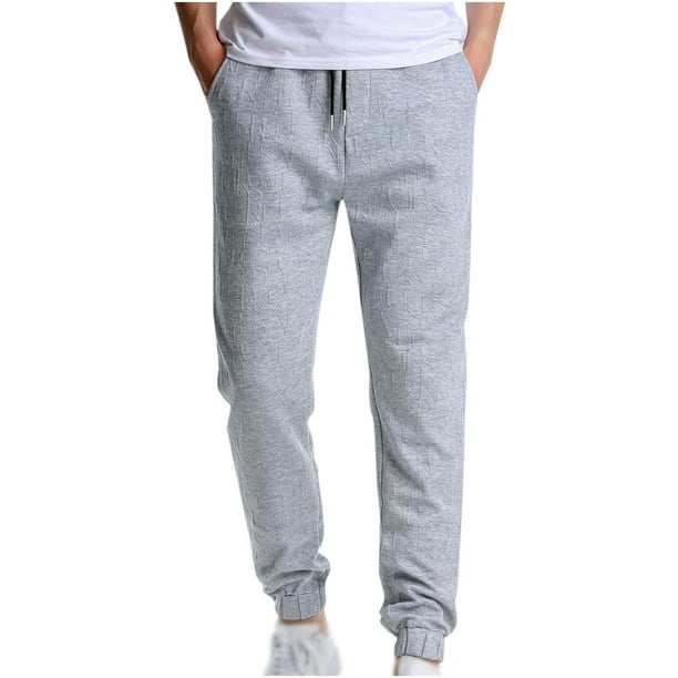 Los hombres y las mujeres pueden usar pantalones de jogging con cordón de color sólido Fridja hfkajh100595