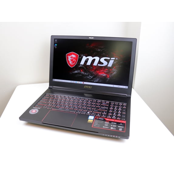 Pre-Owned MSI GS63VR 7RF Stealth Pro 15.6" FHD Gaming Laptop ( Intel Core i7-7700HQ 2.80Ghgz, 16GB Ram Memory, 256GB SSD + 1TB Hard Drive, Nvidia GeForce GTX 1060 6GB Graphics, Windows 10 Home )
