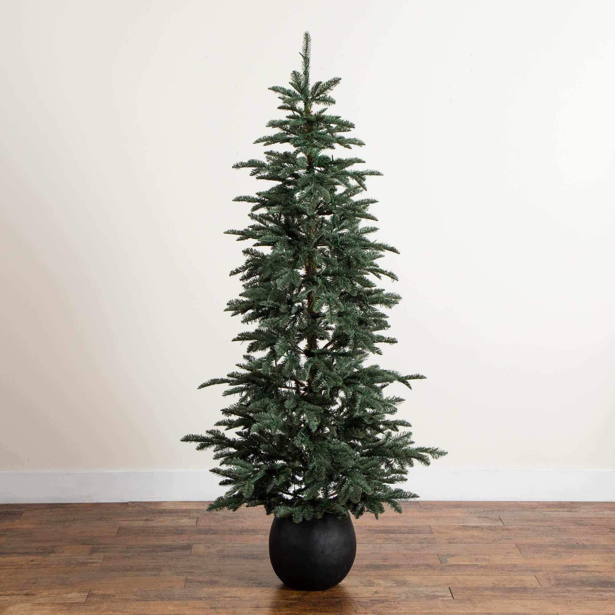 Nearly Natural 6ft. Pre-Lit Artificial Pine Christmas Tree in Round Black Decorative Planter with 60 Warm White LED Lights