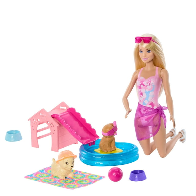 Barbie Puppy Pool Party Playset with doll in pink floral swimsuit and purple sarong kneeling beside a blue heart-shaped pool holding a brown puppy figure wearing pink snorkel goggles on a yellow float, a pink doghouse with slide, tie-dye towel, two feeding bowls, and a pink ball, suitable for imaginative doll play.