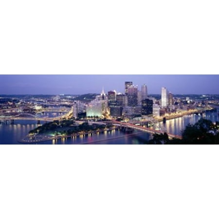- Buildings in a city lit up at dusk Pittsburgh Allegheny County Pennsylvania USA Poster Print
