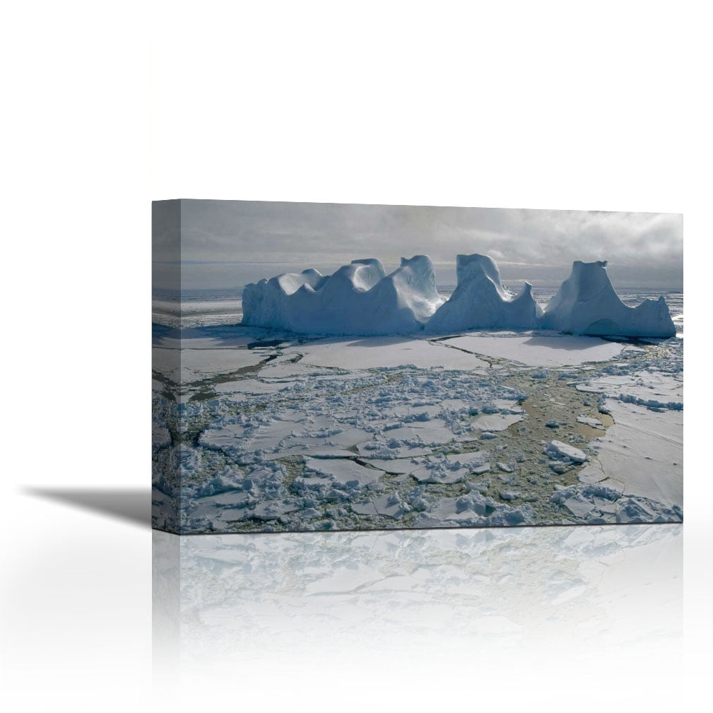Water worn iceberg in sea ice, Lazarev Sea, east Antarctica ...