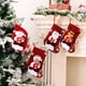 thumbnail image 1 of Juego de 4 calcetines navideños | Calcetines navideños personalizados para colgar en la chimenea | Decoraciones navideñas familiares con diseños de gnomos y Papá Noel, 1 of 8