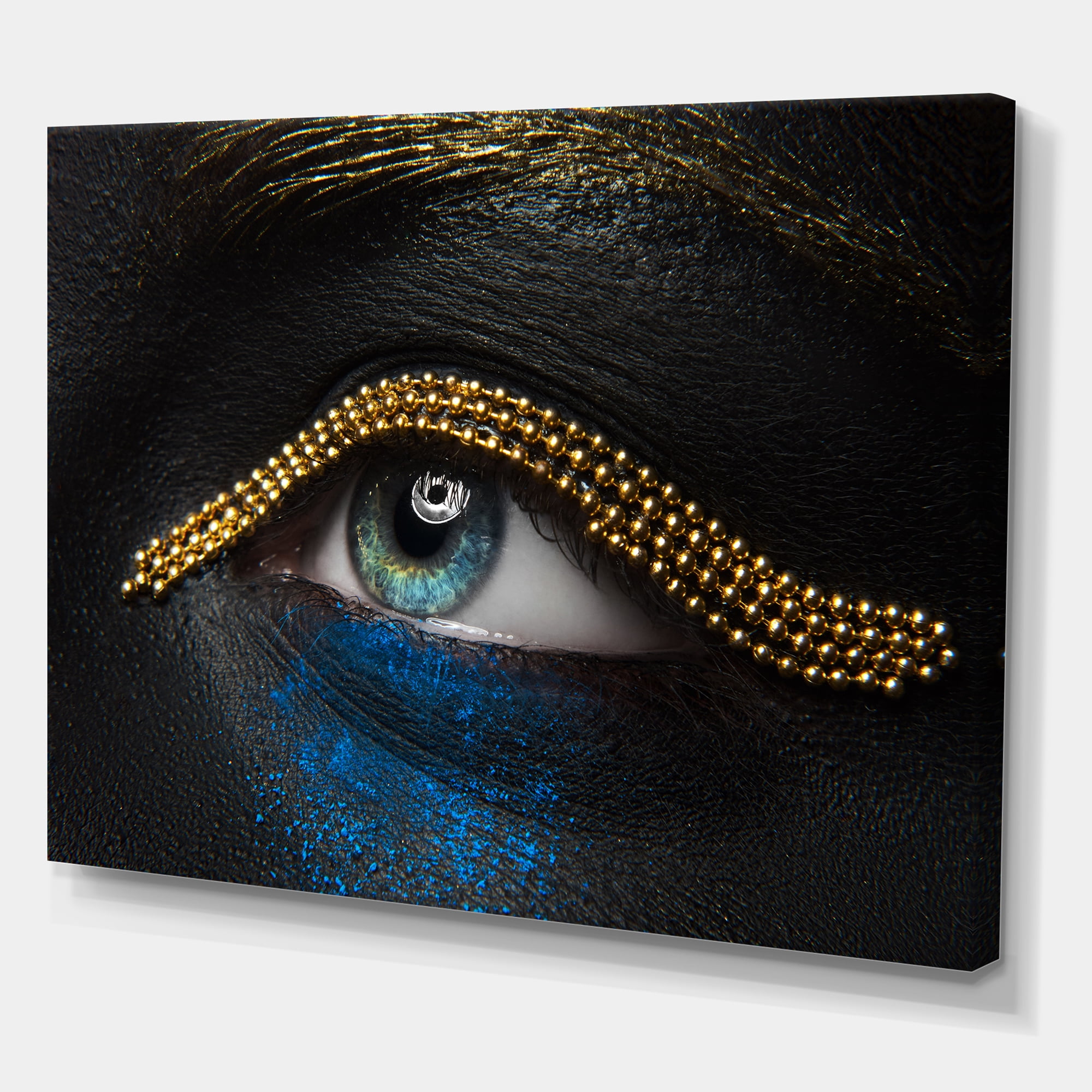 Designart ' Woman Eyes With Black Skin With A Gold Chain ' Modern Canvas Wall Art Print