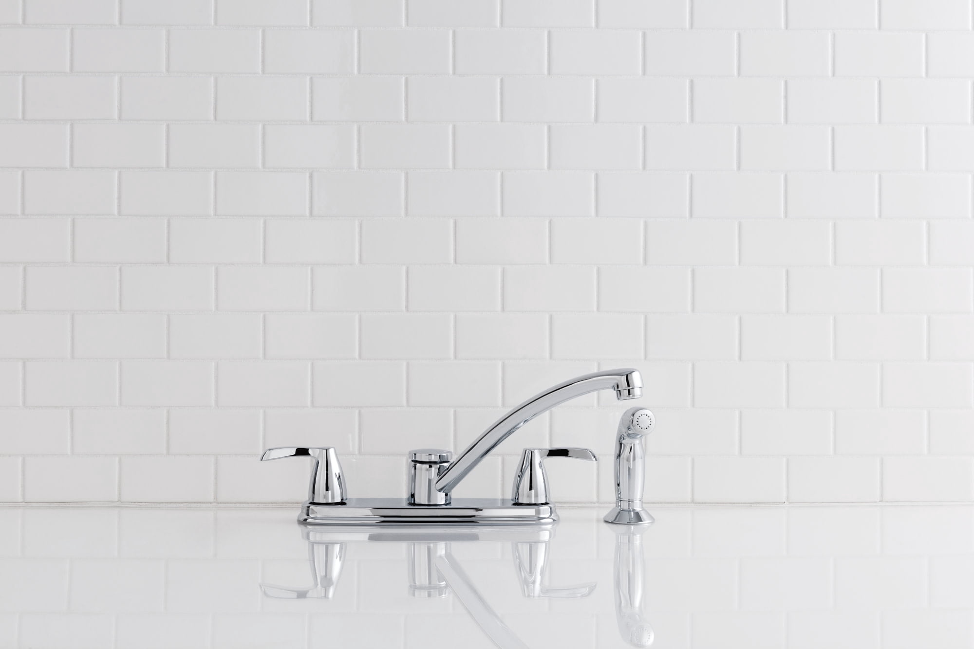 Moen Adler Chrome Two-Handle Low Arc Kitchen Faucet with Side Sprayer