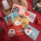 thumbnail image 1 of Juego de 24 tarjetas navideñas: tarjetas de felicitación navideñas con sobres y pegatinas a juego, 6 diseños variados, tarjetas navideñas al por mayor, perfectas para enviar cálidos deseos navideños, 1 of 5