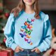 thumbnail image 1 of Vestido de verano para niña con estampado de flores de Pascua, manga corta, bolsillos con volantes y cuello redondo, top de poliéster, 1 of 5