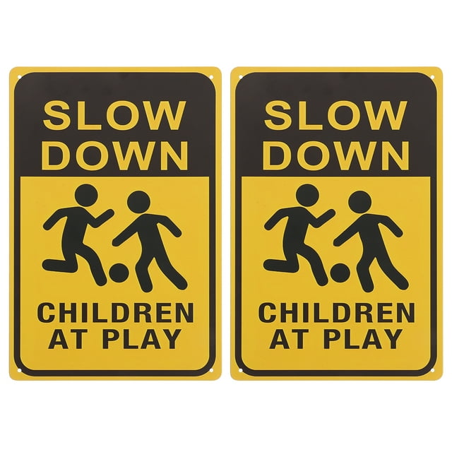 Slow Down Sign 2pcs Children At Play Sign Kids At Play Yard Sign Child Safety Caution Signs Warning Sign For Street Lawn Neighborhoods. The image displays two yellow and black rectangular metal signs with bold text reading 'SLOW DOWN' and 'CHILDREN AT PLAY.' Each sign includes a graphic of two children playing with a ball. These durable, weather-resistant signs are designed for outdoor use in streets, lawns, and neighborhoods to alert drivers and pedestrians to the presence of children. Pre-drilled holes allow for easy installation.