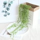 thumbnail image 4 of Xihbxyly Enredaderas Suculentas Artificiales, Diseño de Cuentas Verdes Colgantes, Flores Artificiales de Plástico, Decoración Versátil para El Hogar y La Oficina, Arreglo de Mesa para Bodas, 78 Cm de, 4 of 7