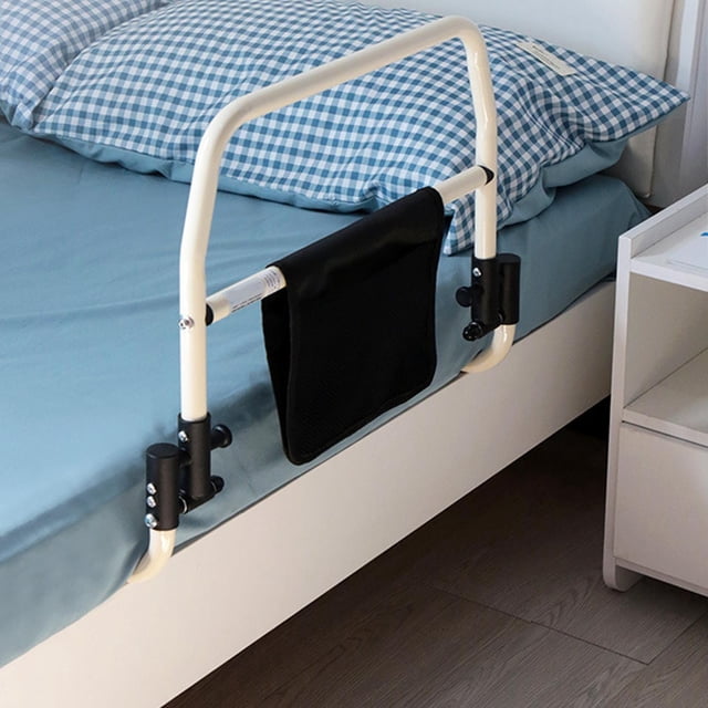 barra de soporte de cama yinane plegable para ancianos acero blanco riel lateral frontal de acero blanco fijado bajo colchón con perillas negras y base ancha con orificios para tornillos; bolsillo de almacenamiento negro colgante en el travesaño, plegable para guardado; también suele usarse como ayuda para incorporarse desde la cama.