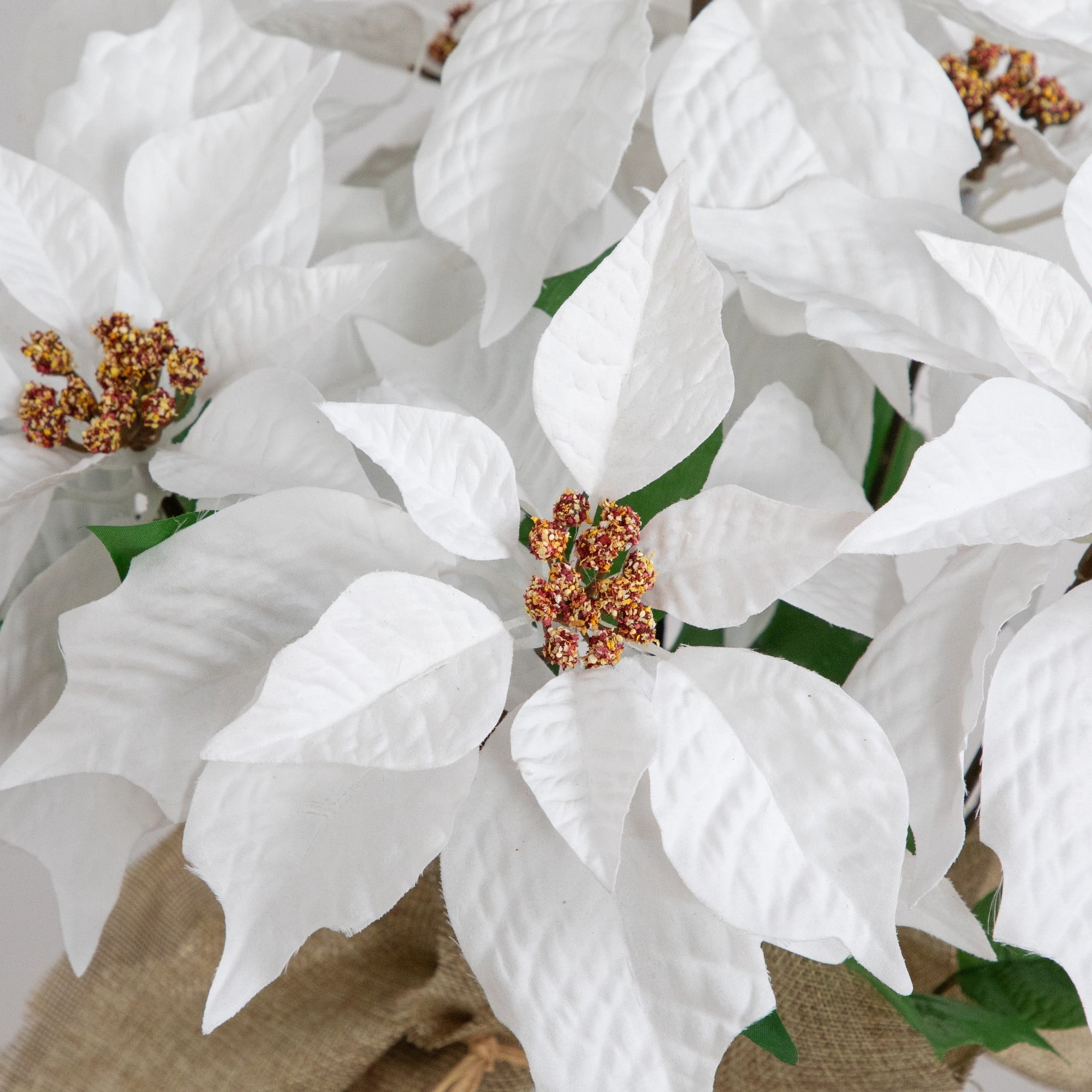 16in. Artificial Poinsettia Arrangement in Burlap Planter