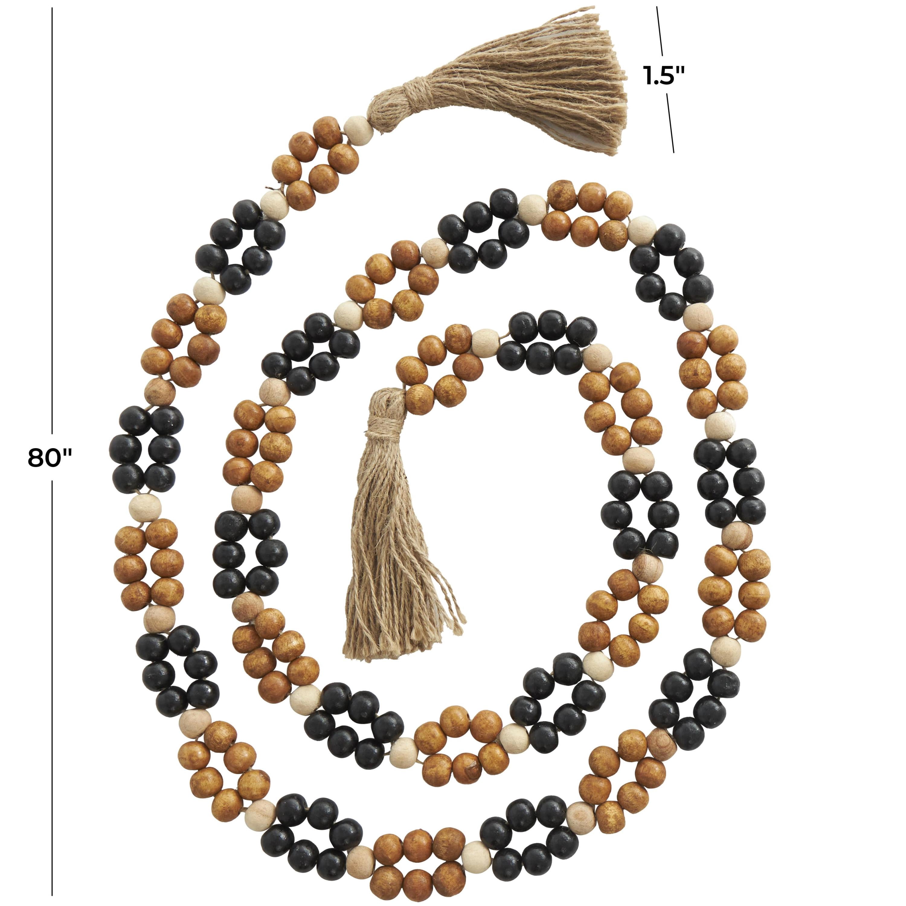DecMode Handmade Round Double Layered Long Carved Brown Mango Wood Garland with Tassel with Black and Cream Accents