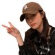 thumbnail image 1 of Una cara de bordado de letras pequeña todo con una gorra para tapar el calor., 1 of 5
