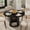 black, variant on Space-Saving 47'' Modern Black Round Dining Table for 4-6 – Kitchen & Dining Room Table with 2-Tier Storage Shelf, Sliding Door, Fluted Pedestal – Ideal for Small Spaces – Black