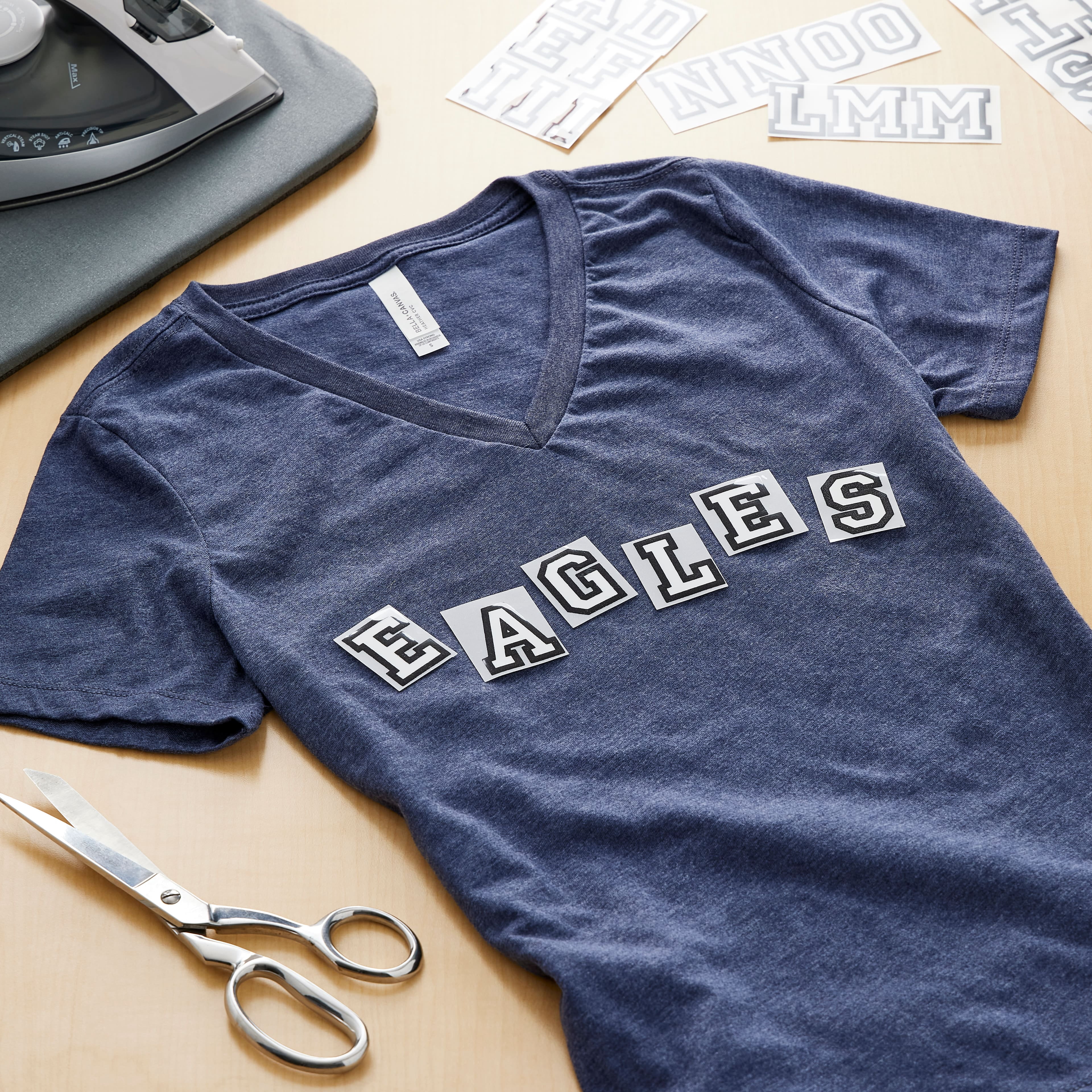 12 Packs: 49 ct. (588 total) 1.5" Iron-On White with Black Outline Athletic Letters by Make Market