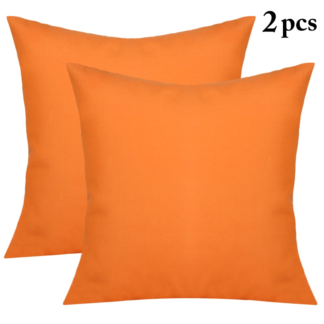 orange pillows and throws