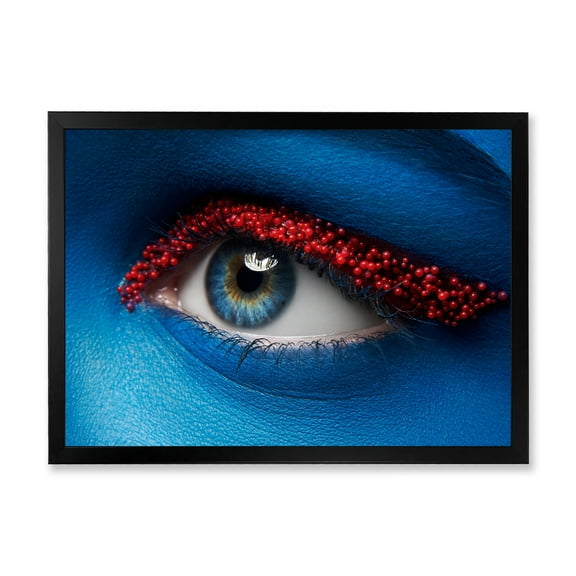 Designart 'Woman Eye With Blue Paint On Face & Red Balls' Modern Framed Art Print