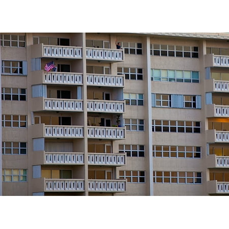 Nyc Hotel With Balcony Canvas Print An onlooker waves an American Flag on the balcony of a hotel as the USS Wasp (LHD 1) floats into For Stretched Canvas 10 x 14 ()