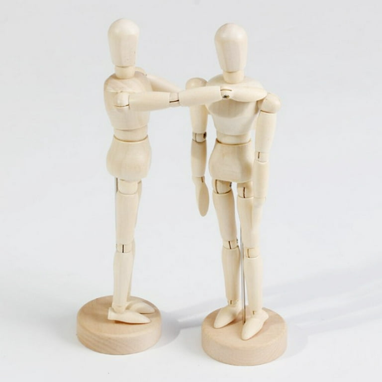 Miniature wooden mannequin in a thinking pose Stock Photo