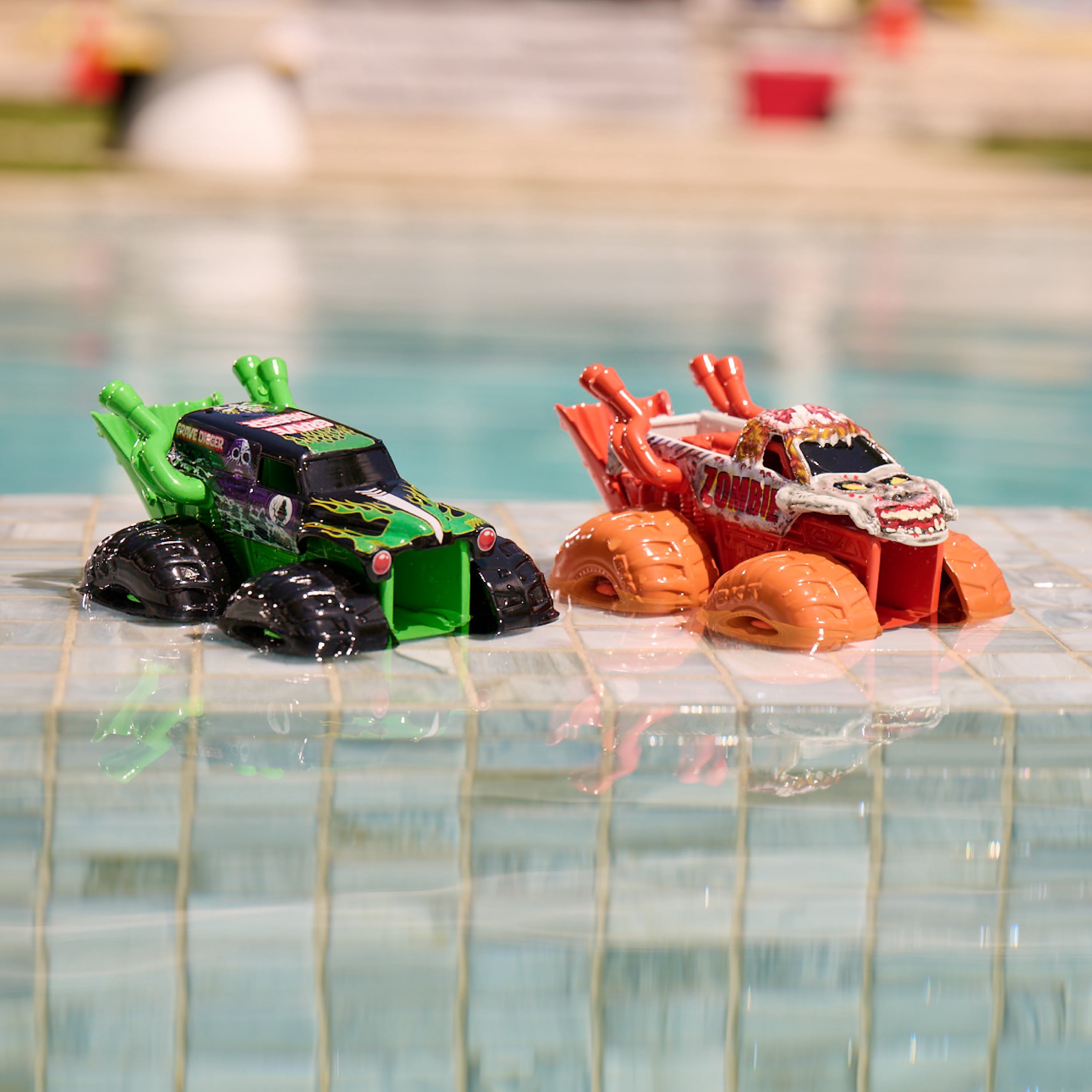 SwimWays Monster Jam Wave Sprayer Monster Pack, Grave Digger & Zombie Monster Truck 2-Pack, Kids Pool Toys, Pool Party Supplies, Monster Jam Toys for Kids Ages 4 & Up (No Batteries Required)