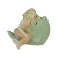 thumbnail image 1 of Whimsical Hand Painted Pastel Mermaid Leaning Against Fish Statue, 1 of 3