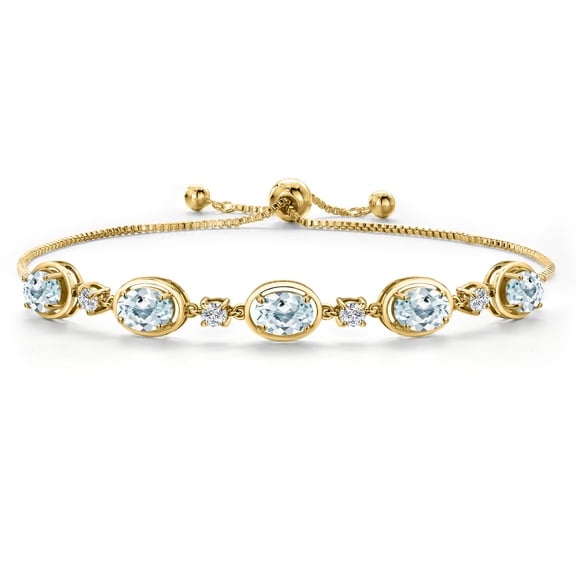 Gem Stone King 18K Yellow Gold Plated Silver Sky Blue Aquamarine and Moissanite Tennis Bracelet for Women | 3.75 Cttw | Gemstone March Birthstone | Oval 7X5MM | Fully Adjustable 10 inch