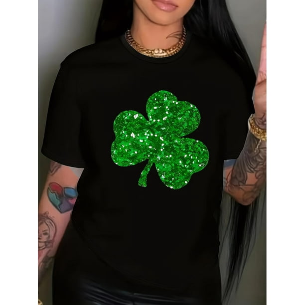 Camiseta negra festiva del Día de San Patricio para mujer con estampado de trébol verde brillante. Cuello redondo informal, manga corta, ideal para primavera/verano/otoño. Lavable a máquina. Mezcla de