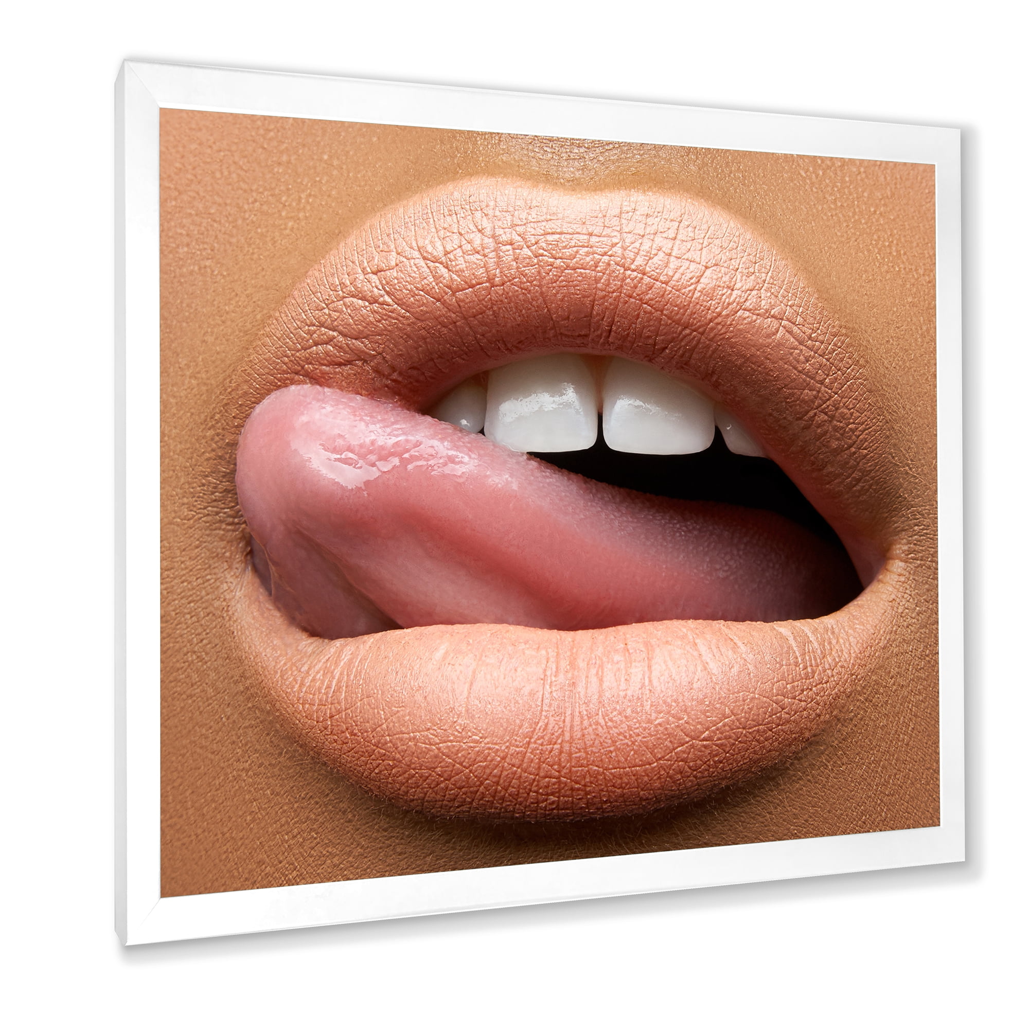 Designart 'Beautiful Dark Skinned Female Tongue Touching Lips' Modern Framed Art Print