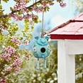 thumbnail image 1 of Casa para pájaros de resina azul para exteriores, ideal para acampar y hacer senderismo, con margaritas y mariposas, ideal para decoración de jardines, balcones y jardinería. Nido de pájaro de resina, 1 of 7
