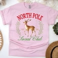thumbnail image 1 of North Pole Social Club T-Shirt | Reindeer Holiday Graphic Tee, Light Pink, Size L, 1 of 6