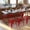 Red, variant on Emma + Oliver Set of Four Teal Table Height Backless Stacking Welded Iron Stools with Wooden Seats and Under Seat Bracing for Indoor Use