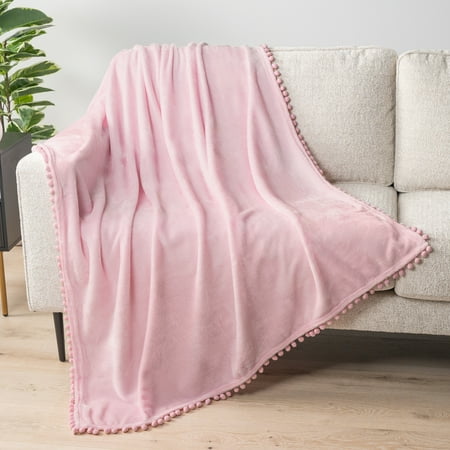PAVILIA Fleece Throw Blanket for Couch with Pom Pom Fringe Light Pink Soft Cozy Fuzzy Flannel Blanket for Sofa Bed Lightweight Plush All Season Throw 50x60 Inches