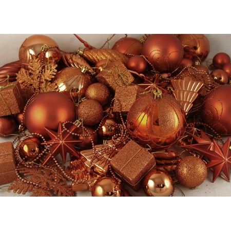 A sweet tree with blue, orange and red ornaments and bows ...