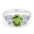 thumbnail image 2 of Gem Stone King 10K White Gold Green Peridot White Topaz and Diamond Accent Three-Stone Engagement Ring for Women | 2.38 Cttw | Oval 8X6MM and 6X4MM | Available in Size 5, 6, 7, 8, 9, 2 of 4