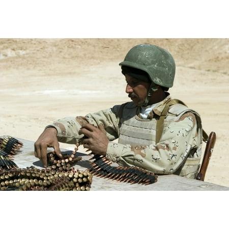 An Iraqi army soldier prepares belts of ammunition for his PKM 762-mm machine gun Canvas Art - Stocktrek Images (34 x 23)