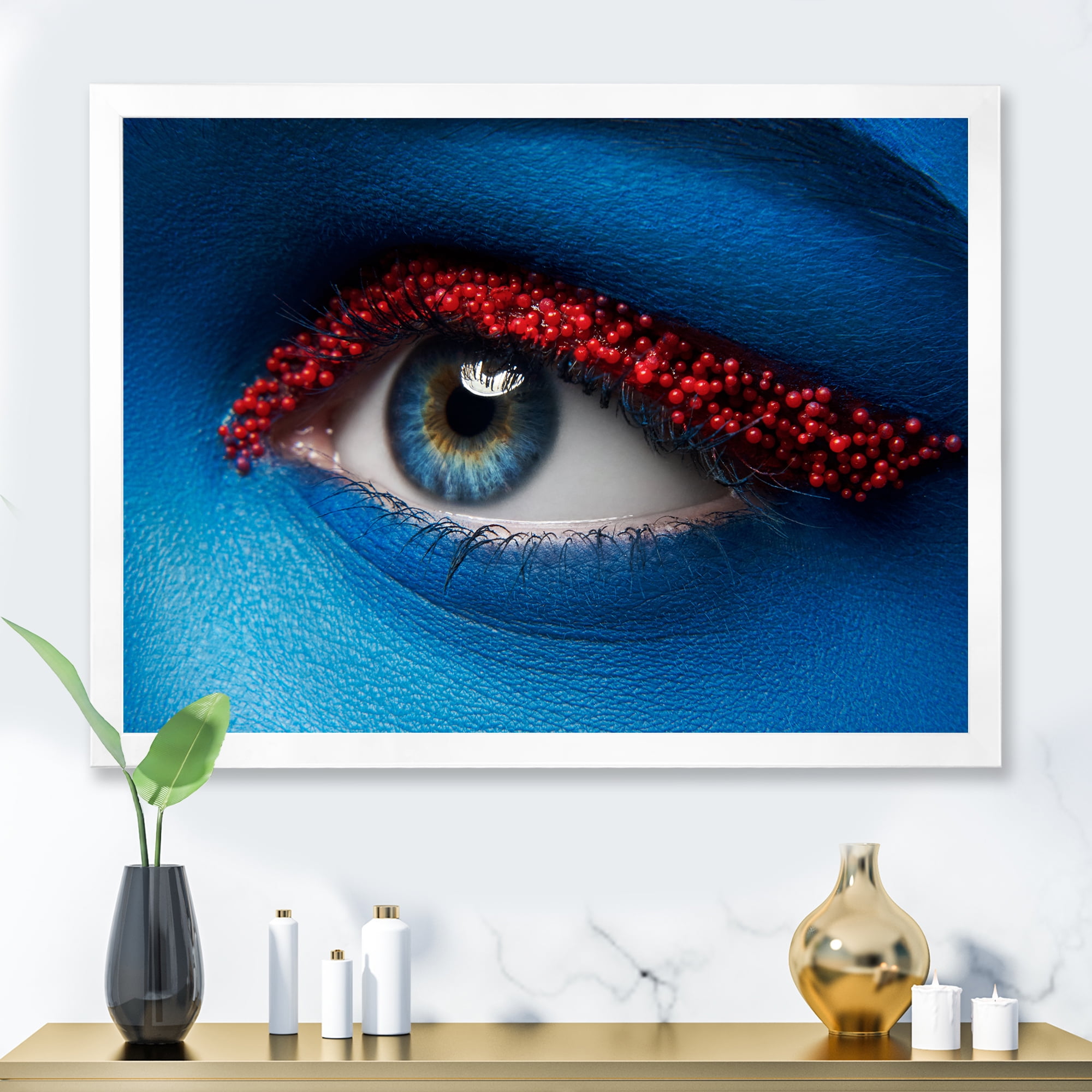 Designart 'Woman Eye With Blue Paint On Face & Red Balls' Modern Framed Art Print