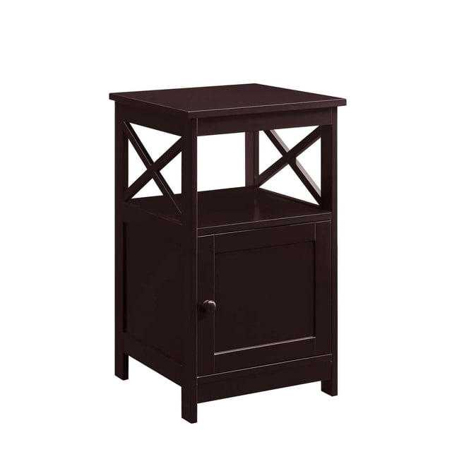 Convenience Concepts Oxford Table d'Appoint avec Armoire en Fini Bois Espresso. une Table d'Appoint Polyvalente au design Contemporain avec des Panneaux Latéraux Géométriques, une Porte d'Armoire de Style Shaker et un Motif Latéral en « X ». Comprend une surface Supérieure, une Tablette Ouverte et une Armoire Fermée pour le Rangement. Convient aux Salons, Tonnelles Ou Bureaux à Domicile. Dimensions : 16L X 16W X 26H.