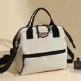 thumbnail image 2 of Bolso de mano para madre y bebé de lona de gran capacidad de color sólido de venta caliente 2024 nuevo bolso cruzado con cremallera para mujer, 2 of 5