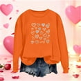 thumbnail image 1 of Mceream Chandails de la Saint-Valentin pour Femmes Mode Décontractée Imprimé Cœur Graphique Manches Longues Chemises Surdimensionnées Col Rond Chandail Hauts Grande Taille Orange TTG, 1 of 5