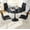 Black Table + Silver&Black Chairs, variant on 5-Piece Dining Table Set, 31.5" Round Tulip Pedestal Dining Table and 4 Ergonomically Designed PU Chairs, Dining Table Set for Kitchen, Living Room, Office