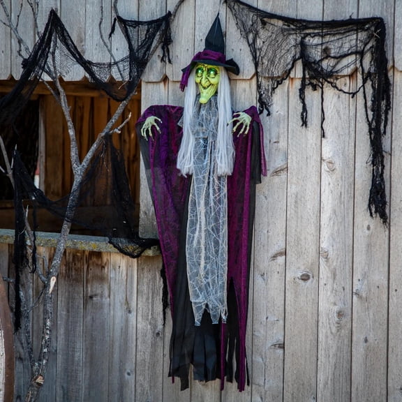 Morris Costumes 4 ft Hanging Animated Witch with Green Eyes Decoration - Black