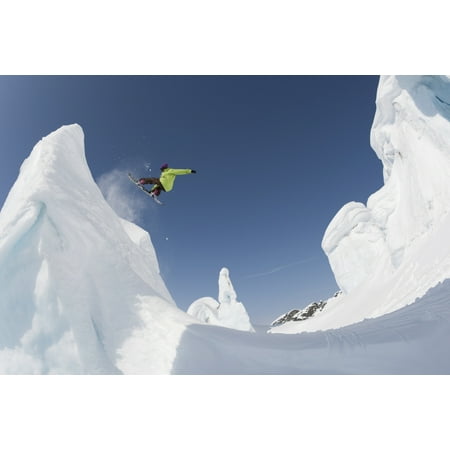 Professional snowboarder Kevin Pearce extreme snowboarding on formations on a glacier Haines Southeast Alaska