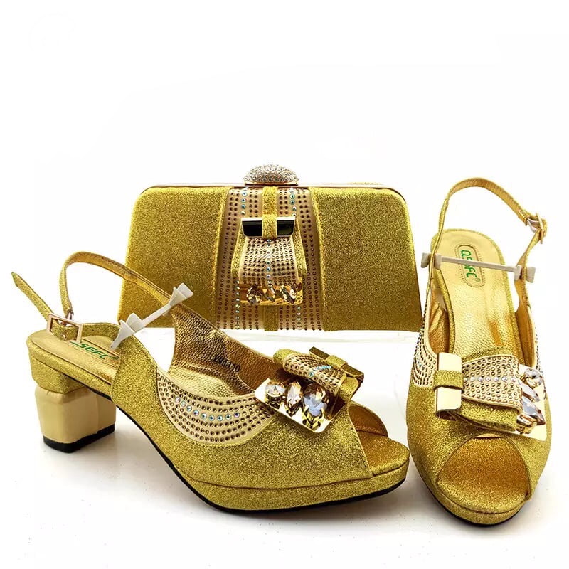 gold sandals and matching bag